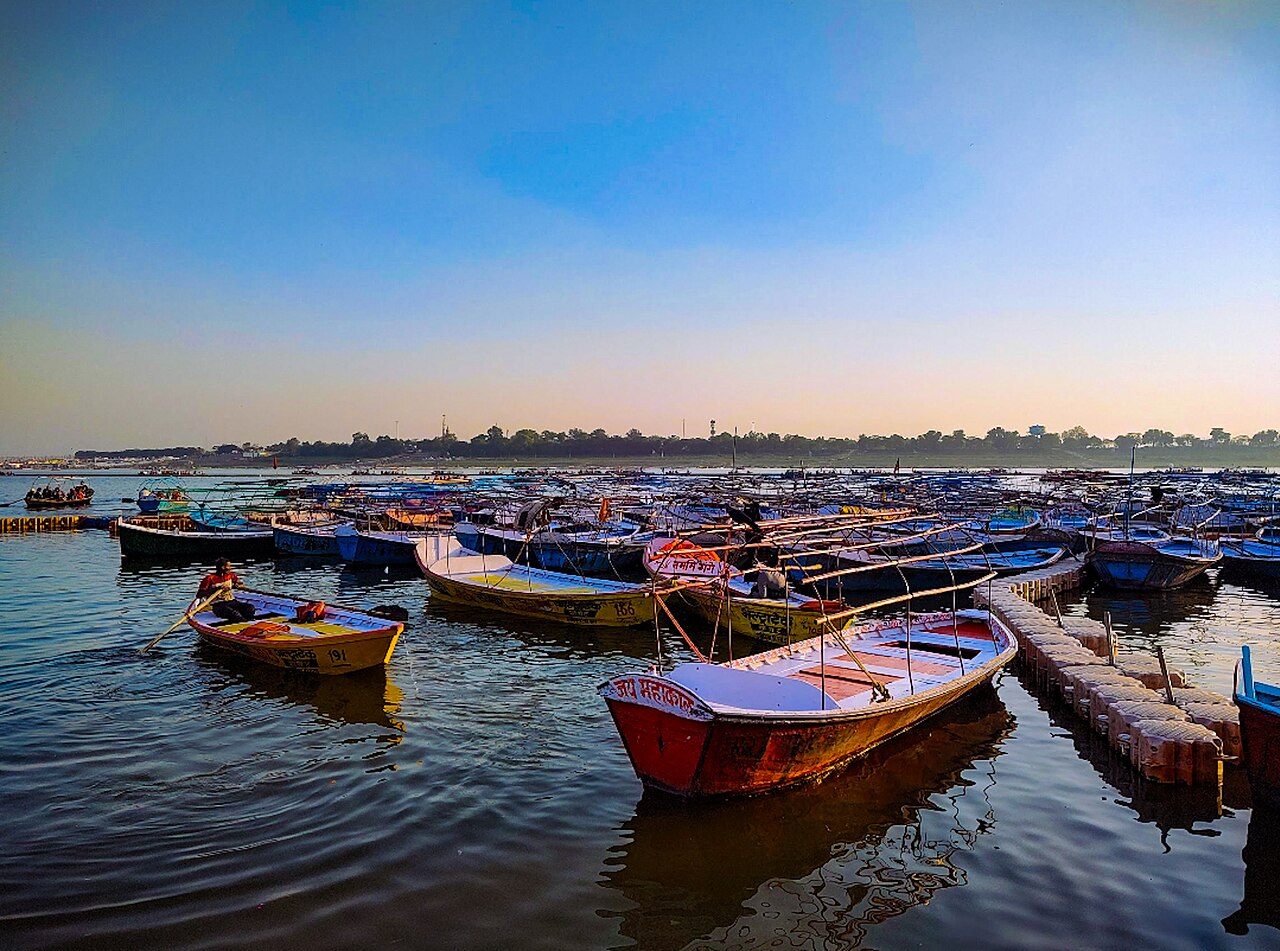 Triveni Sangam confluence with boats at sunrise, Prayagraj